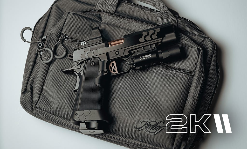 Kimber 2K11 Series pistol with tactical light and modern slide design resting on range bag.