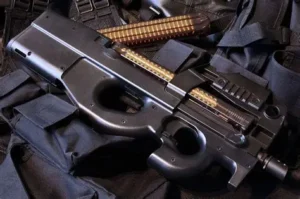 FN P90 personal defense weapon with top-mounted 50-round magazine displayed on tactical gear