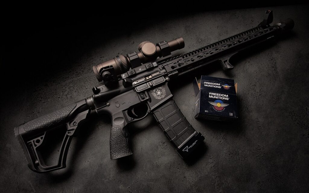 Daniel Defense rifle with accessories displayed on dark background