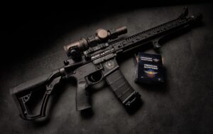 Daniel Defense rifle with accessories displayed on dark background